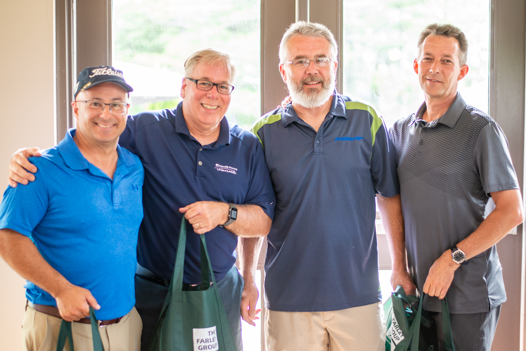 cliff arcand, ian clarke, and team winning lowest net at Norm Jary Golf Tournament